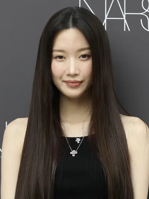 Moon Ga-young wearing a black sleeveless top and looking at the camera.