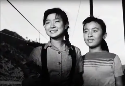 Kim Young-ok (left) and Jo Hyeon-ju (right) in the 1959 South Korean film Even the Clouds Are Drifting.jpg