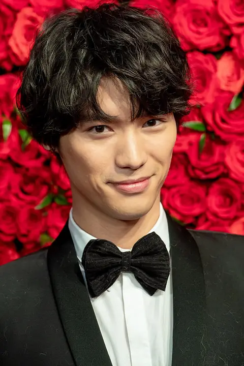 Fukushi Sota in a black suit